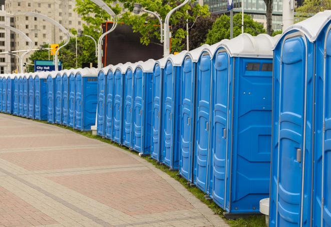 a row of portable restrooms at a trade show, catering to visitors with a professional and comfortable experience in Bell